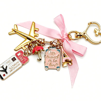 1pc Elegant Pink Bow Travel Keychain Pendant, Oil Drop Airplane, Luggage, Boarding Pass, Passport, Eiffel Tower DIY Decoration, Women's Bag Charm, Suitcase Decoration, Shoulder Bag Accessory, Multi-Fu