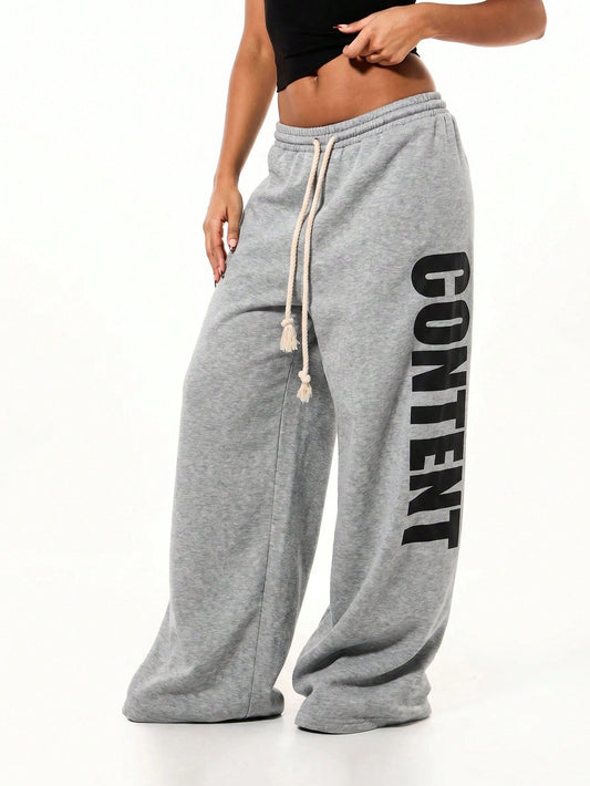 SUMWON WOMEN Oversized Wide Leg Fleece Sweatpants With Bold Vertical "Content" Graphic Print And Drawstring Waist